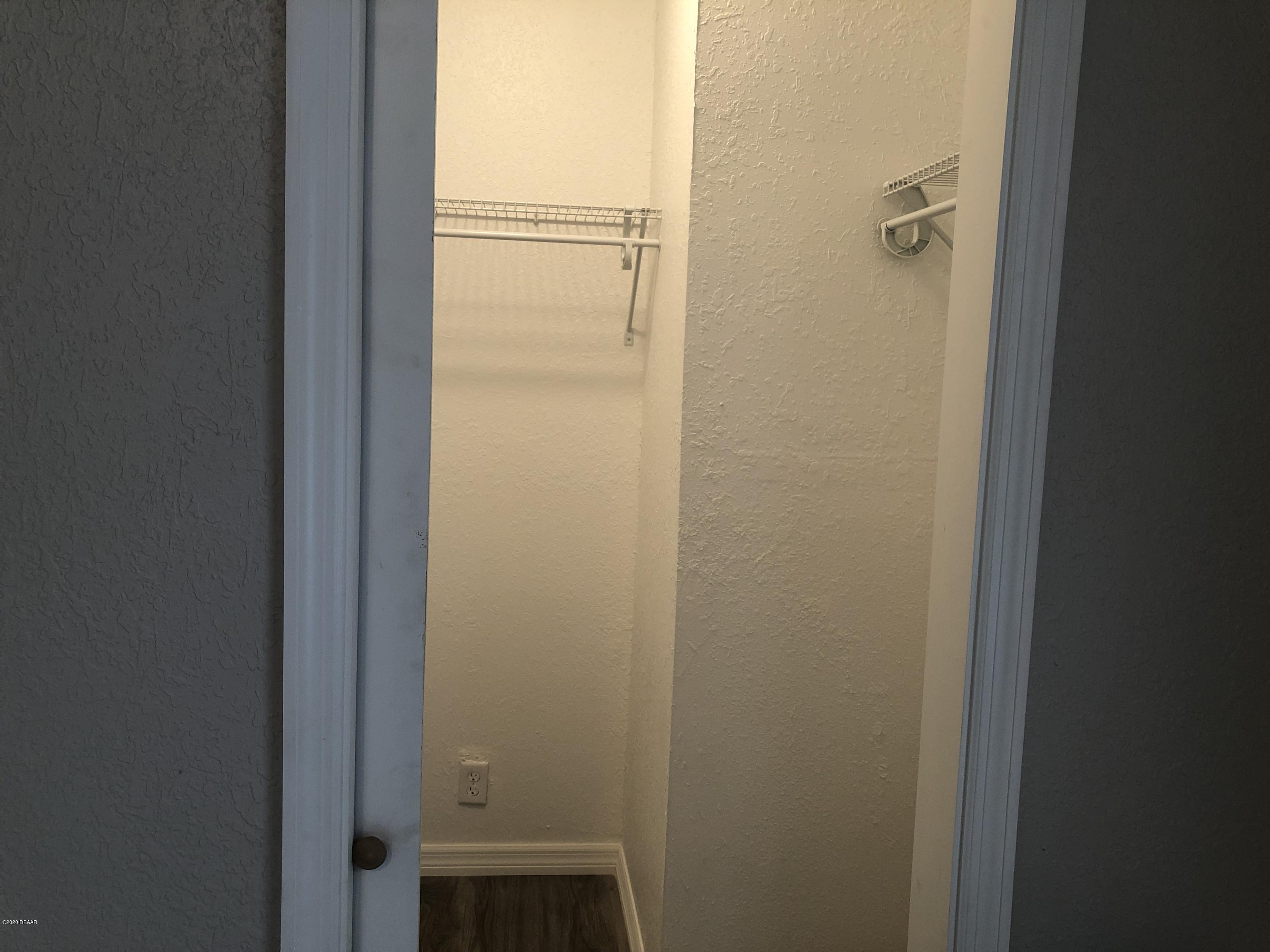 294 Roosevelt Drive Ormond Beach, FL 32174 - Photo 12 of 18 a bathroom with a glass shower door