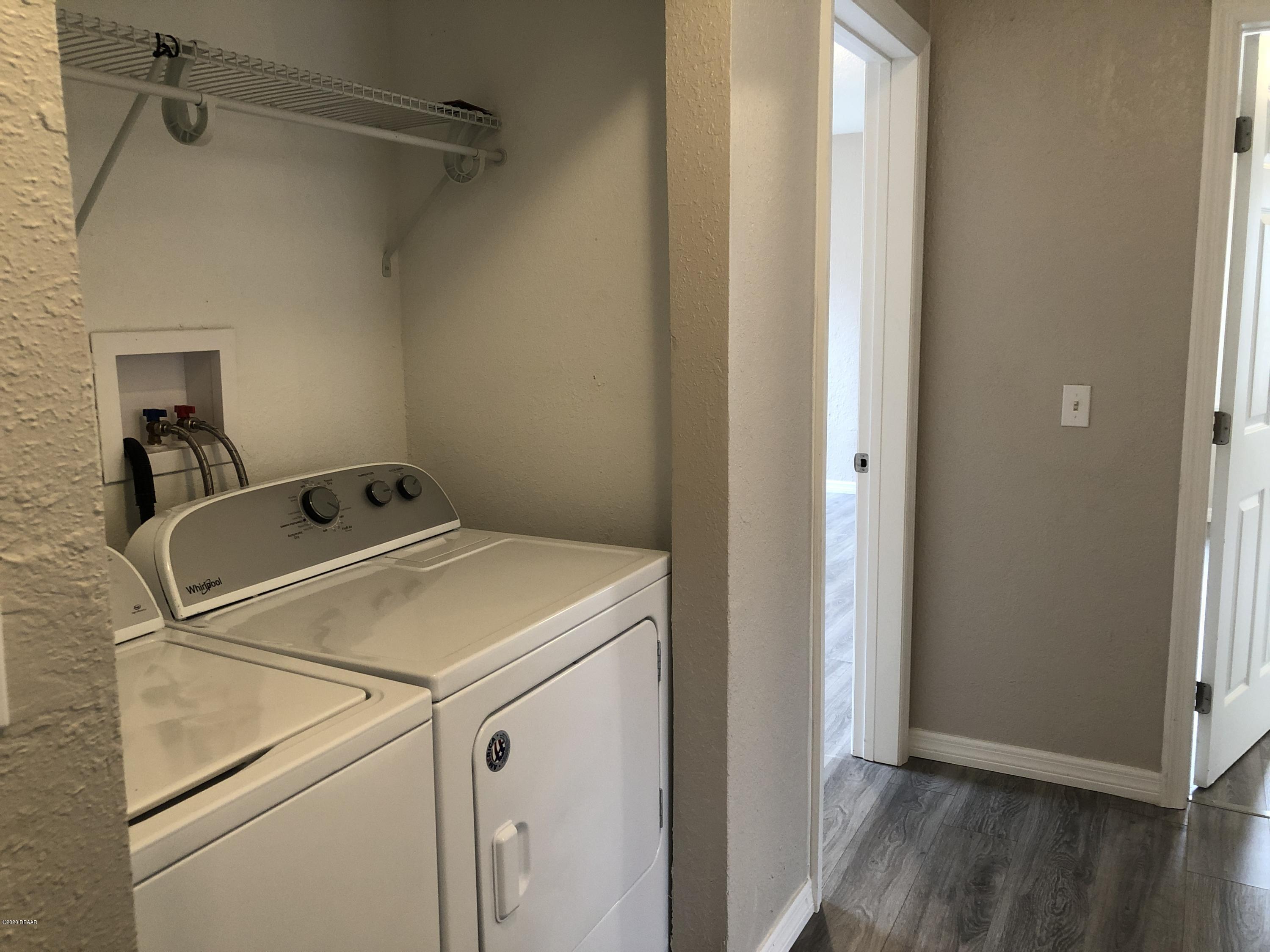 294 Roosevelt Drive Ormond Beach, FL 32174 - Photo 16 of 18 a utility room with dryer and washer