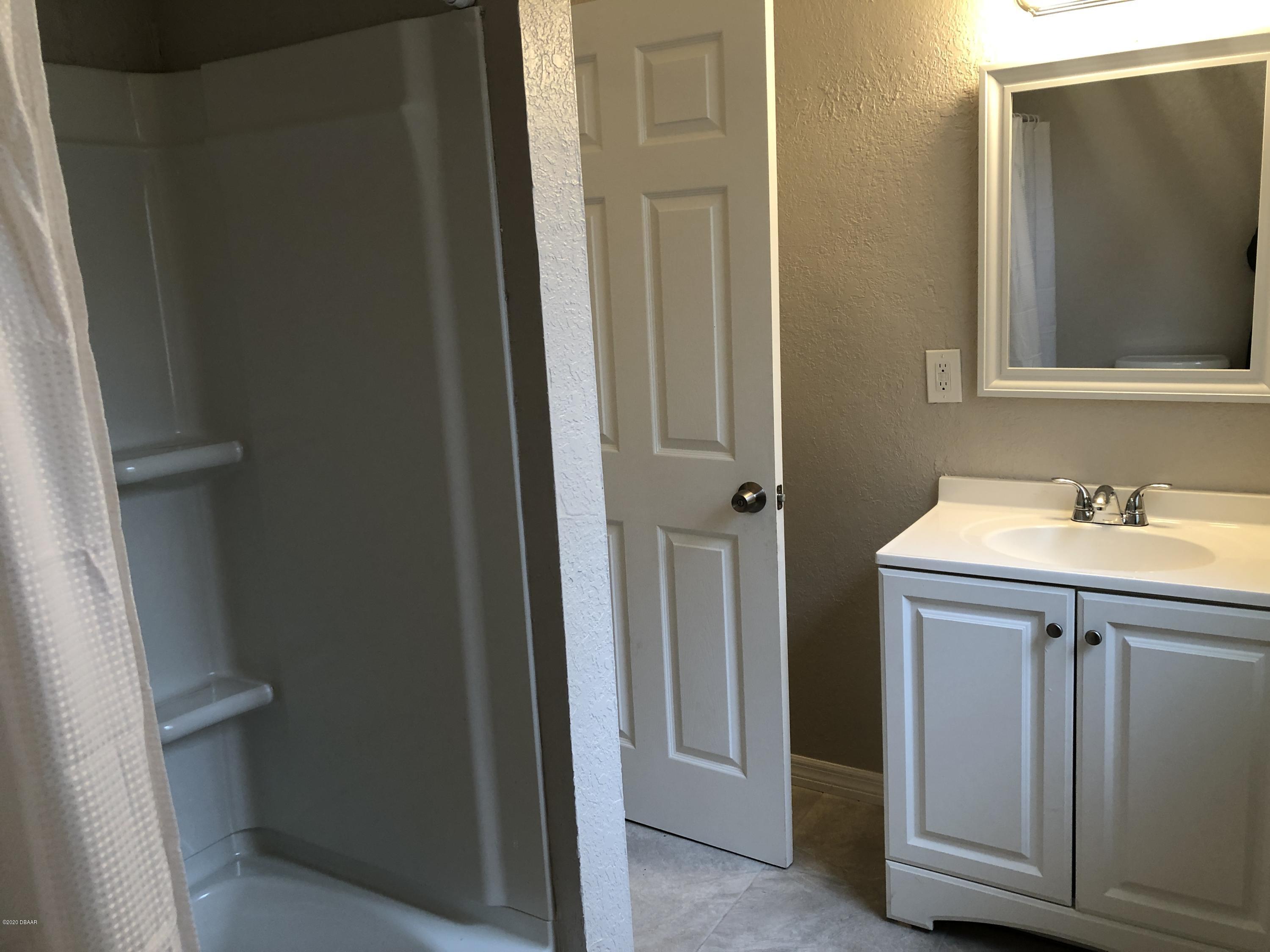 294 Roosevelt Drive Ormond Beach, FL 32174 - Photo 18 of 18 a bathroom with a sink toilet and vanity