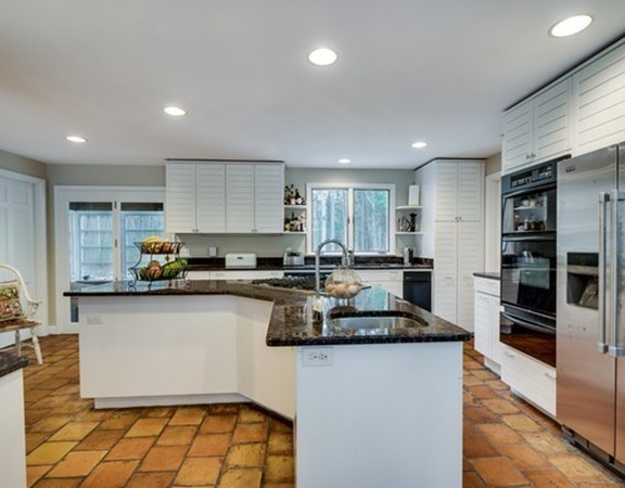 79 Ledge Rock Road Concord, MA 01742 - Photo 3 of 28 a kitchen with stainless steel appliances granite countertop a sink a stove a refrigerator a microwave a counter top and cabinets