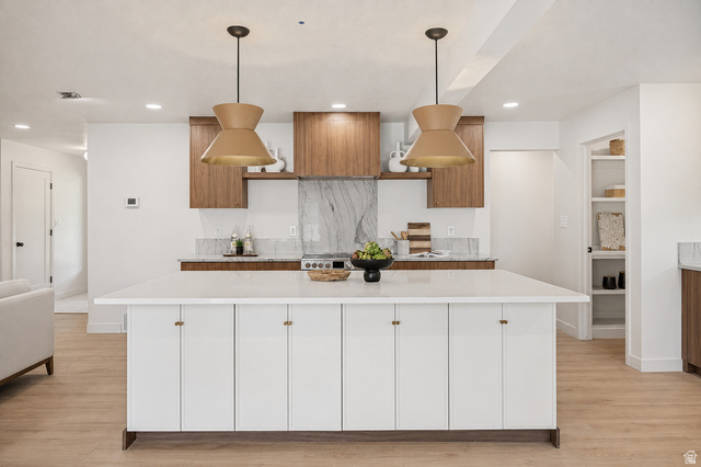 1168 East Center Street Bountiful, UT 84010 - Photo 8 of 38 Kitchen featuring a large central island with white cabinetry, wood-finish flooring, recessed lighting, and two pendant light fixtures
