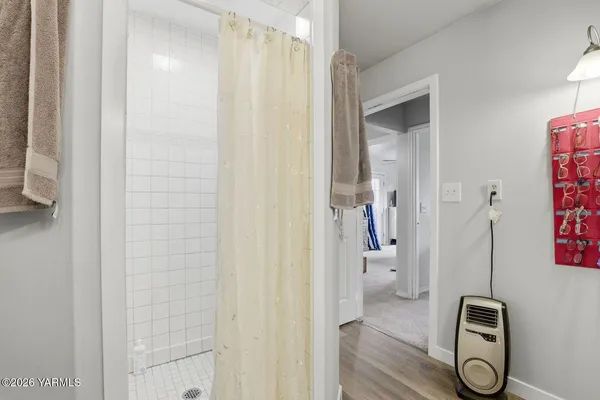a view of a patio with table and chairs under an umbrella
