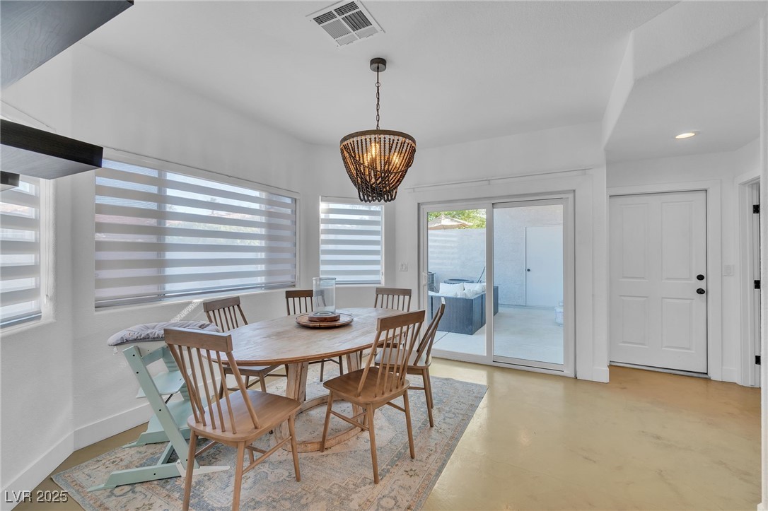 655 Florence Drive Boulder City, NV 89005 - Photo 15 of 63 Dining space with concrete floors and a chandelier