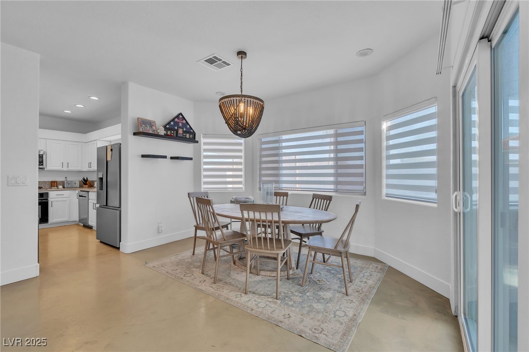 655 Florence Drive Boulder City, NV 89005 - Photo 16 of 63 Dining room featuring finished concrete floors, a chandelier, and recessed lighting