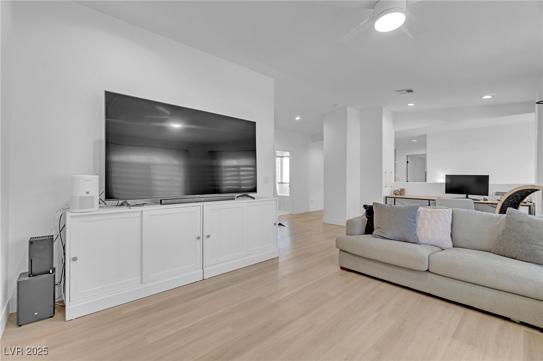 655 Florence Drive Boulder City, NV 89005 - Photo 22 of 63 Upstairs Living area featuring light wood finished floors, recessed lighting, and ceiling fan. This space is large enough to convert to a 3rd bedroom and still have room for a loft.