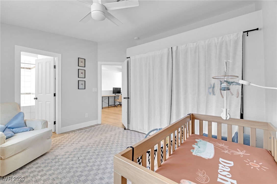 655 Florence Drive Boulder City, NV 89005 - Photo 26 of 63 Bedroom w/mountain views featuring a nursery area and ceiling fan
