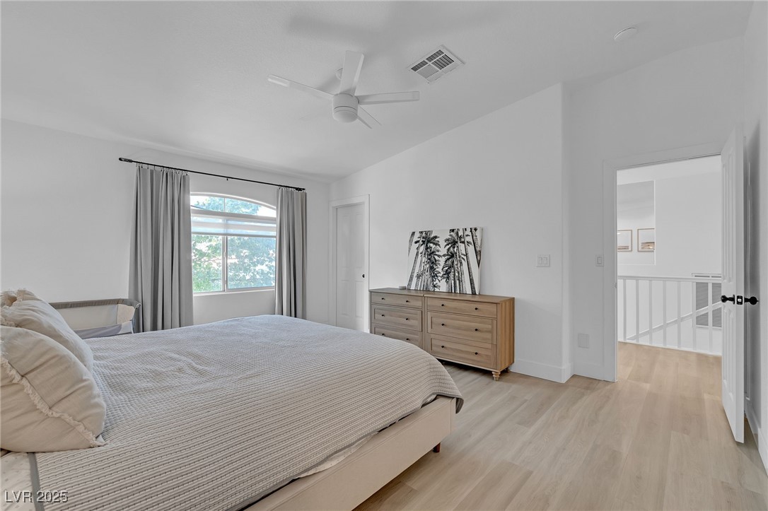 655 Florence Drive Boulder City, NV 89005 - Photo 31 of 63 Bedroom with light wood finished floors, lofted ceiling, and a ceiling fan