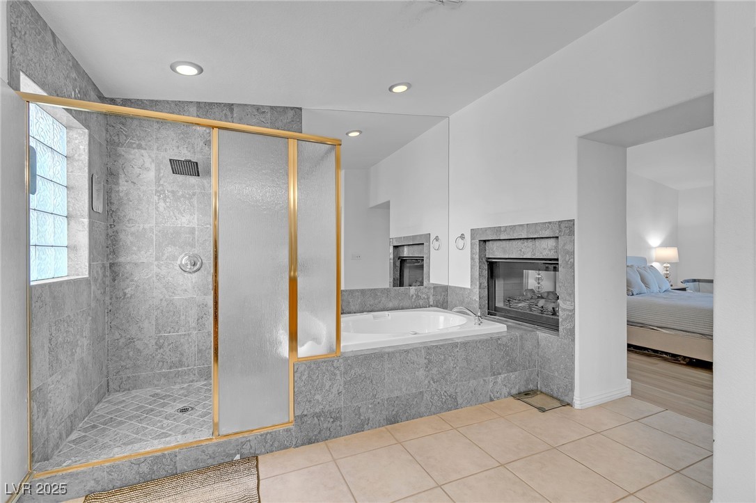 655 Florence Drive Boulder City, NV 89005 - Photo 34 of 63 Ensuite bathroom with a shower stall, a bath, light tile patterned floors, and recessed lighting. You will love the giant size of this Ensuite!