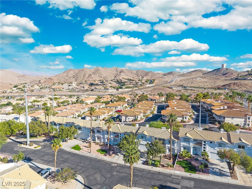 655 Florence Drive Boulder City, NV 89005 - Photo 49 of 63 Aerial perspective of suburban area featuring a mountain backdrop