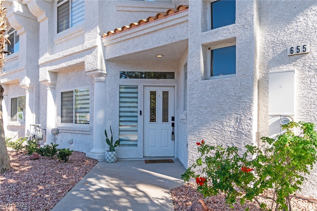 655 Florence Drive Boulder City, NV 89005 - Photo 5 of 63 Doorway to property with stucco siding