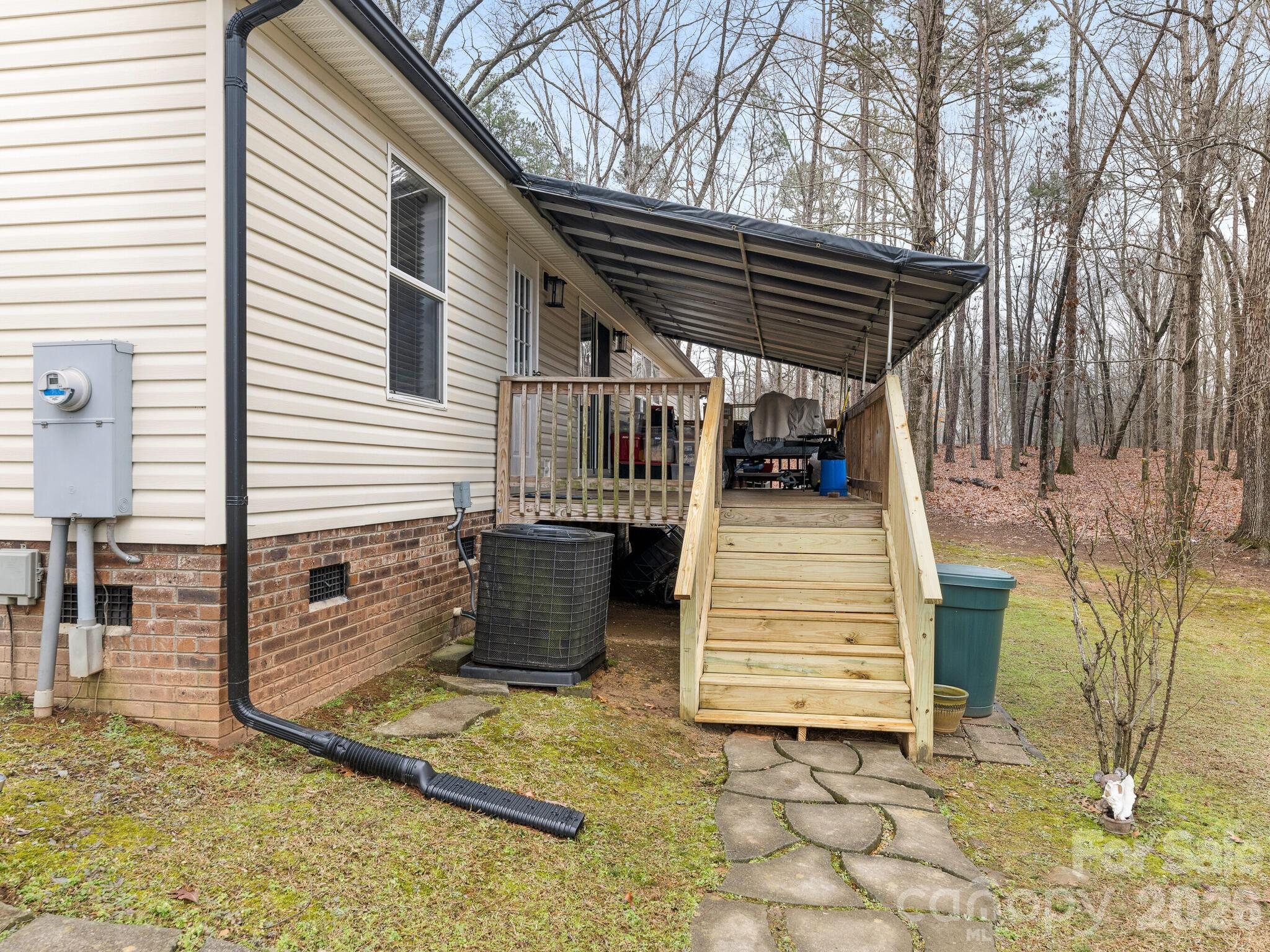 2219 State Rd S-13-106 Pageland, SC 29728 - Photo 15 of 29 a view of a chair and tables in the patio