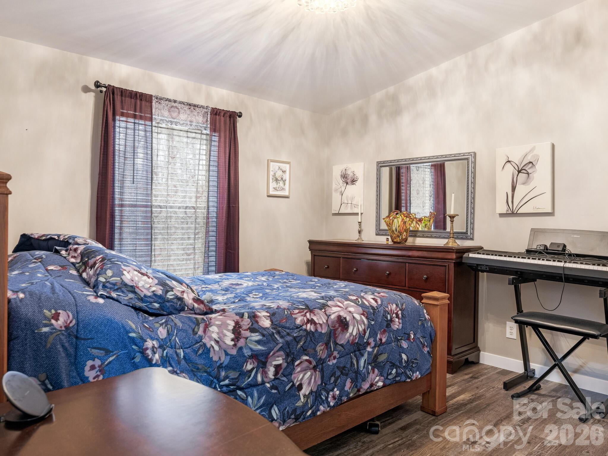 2219 State Rd S-13-106 Pageland, SC 29728 - Photo 16 of 29 a bedroom with a bed and dresser
