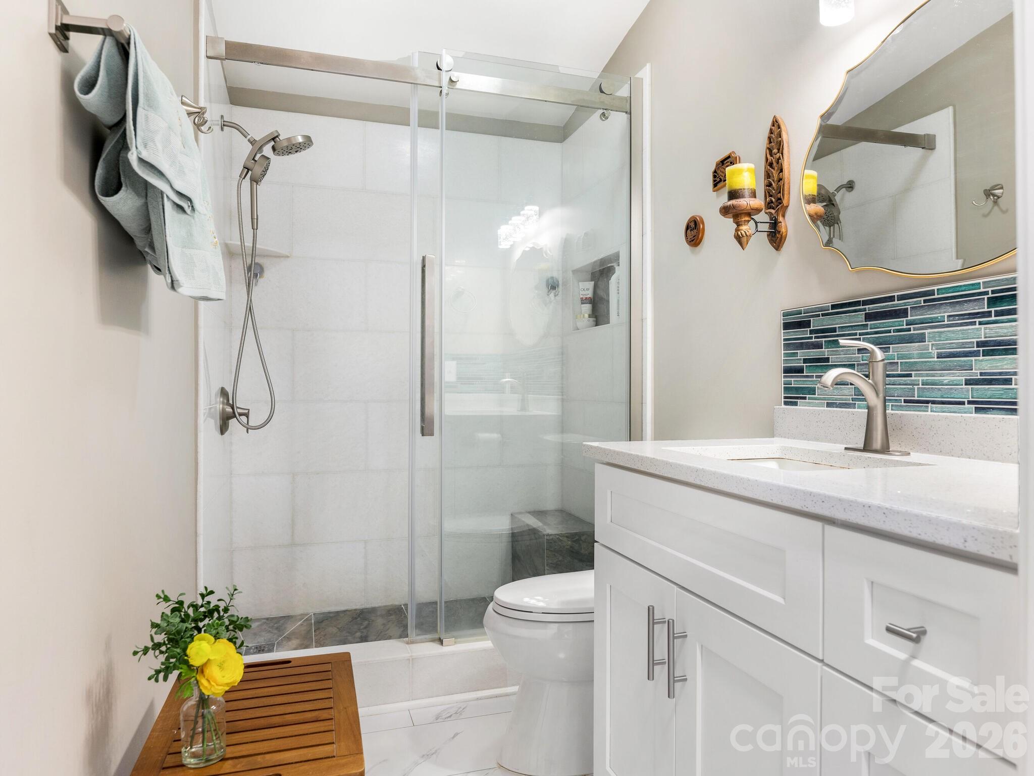 2219 State Rd S-13-106 Pageland, SC 29728 - Photo 17 of 29 a bathroom with a granite countertop sink a toilet and shower