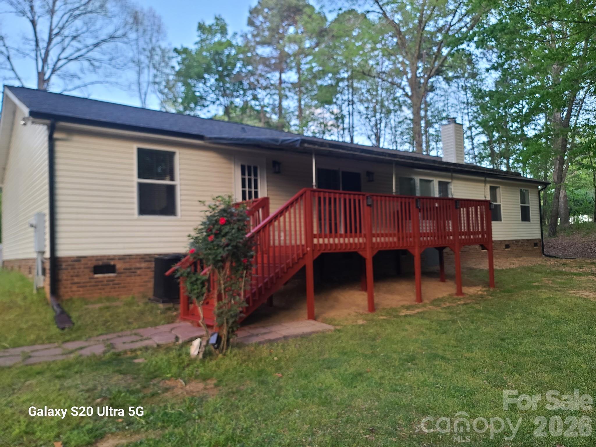 2219 State Rd S-13-106 Pageland, SC 29728 - Photo 23 of 29 a view of a house with a yard chairs and large tree
