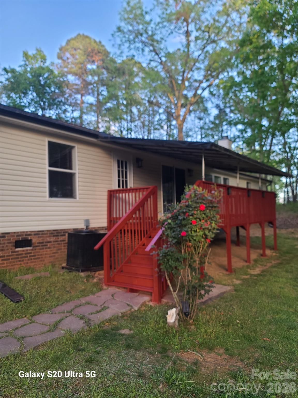 2219 State Rd S-13-106 Pageland, SC 29728 - Photo 29 of 29 a view of a backyard with a patio