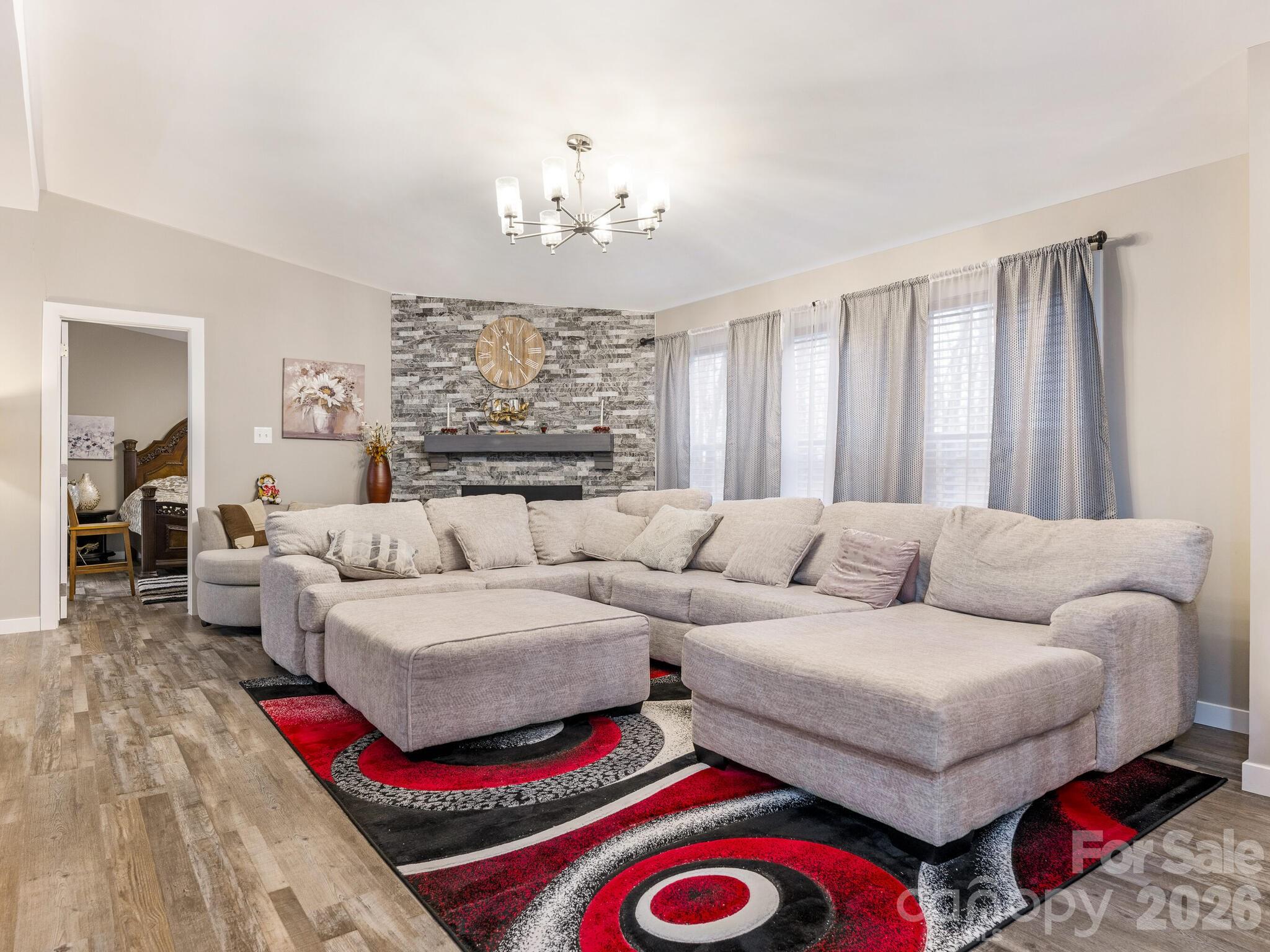 2219 State Rd S-13-106 Pageland, SC 29728 - Photo 6 of 29 a living room with furniture and a chandelier