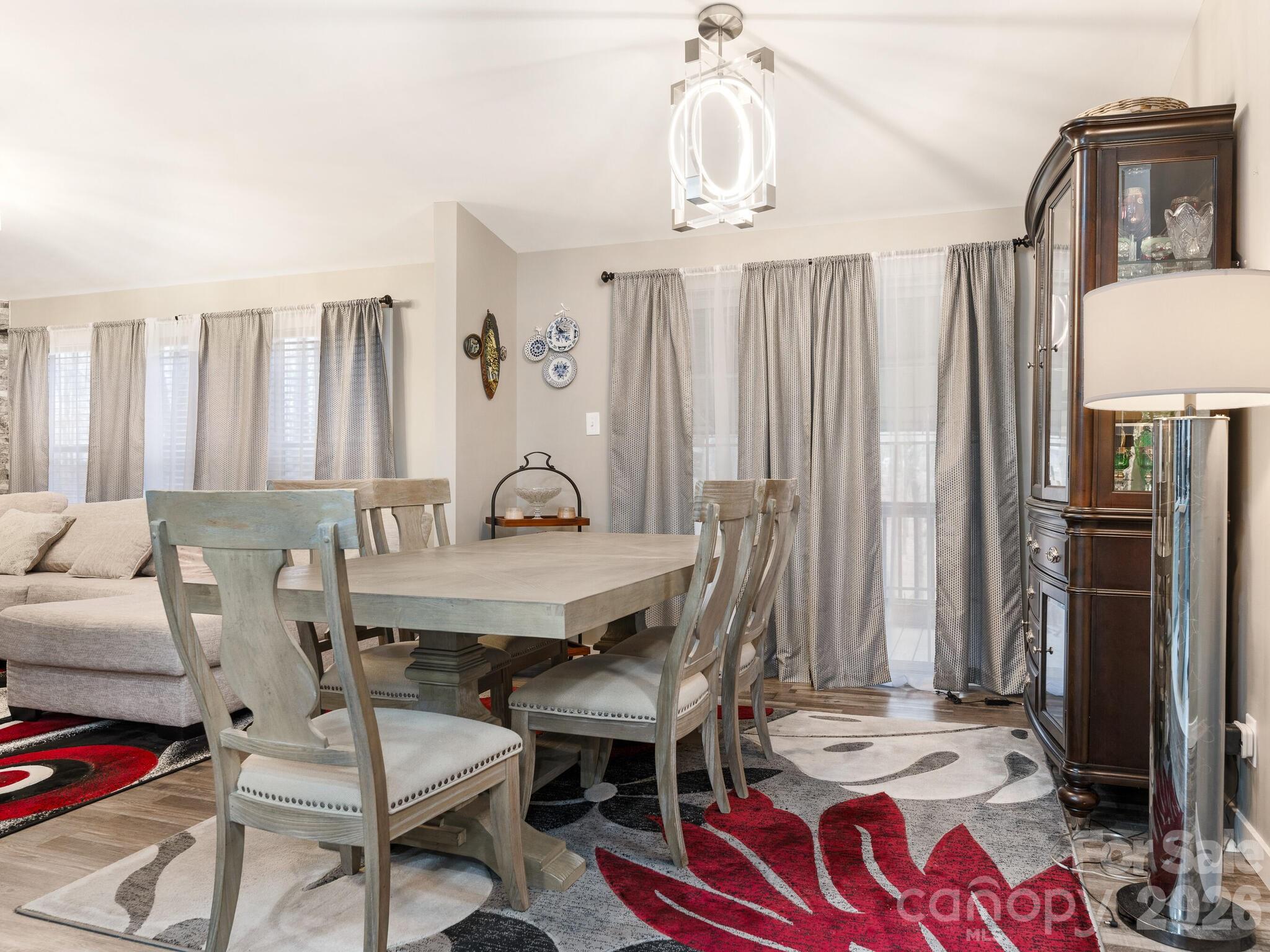 2219 State Rd S-13-106 Pageland, SC 29728 - Photo 10 of 29 a view of a dining room with furniture window and wooden floor