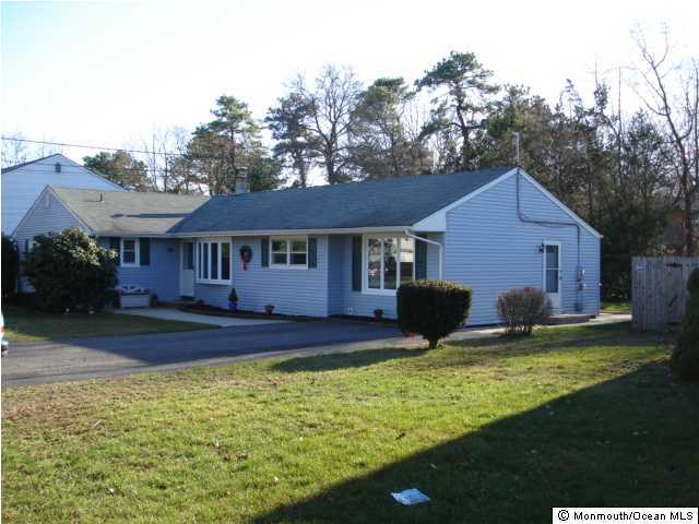 332 Eastham Road Point Pleasant Beach, NJ 08742 - Photo 2 of 3 a view of a yard with plants and large tree