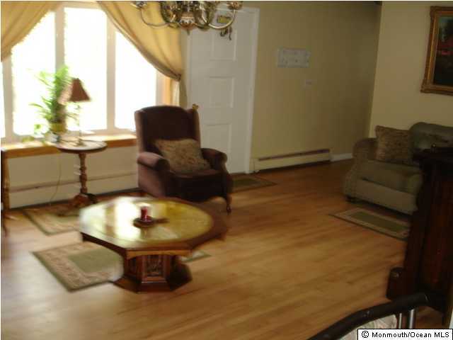 332 Eastham Road Point Pleasant Beach, NJ 08742 - Photo 3 of 3 a living room with furniture and a window
