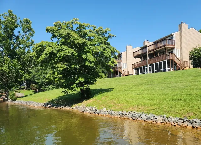 a view of a lake with a building in the background