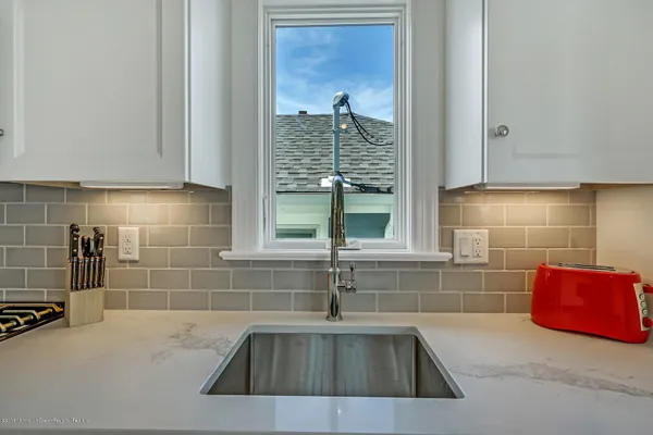 a kitchen with a sink and a window