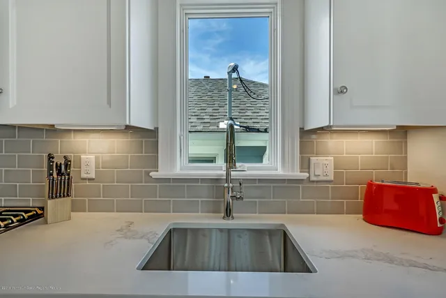 a kitchen with a sink and a window