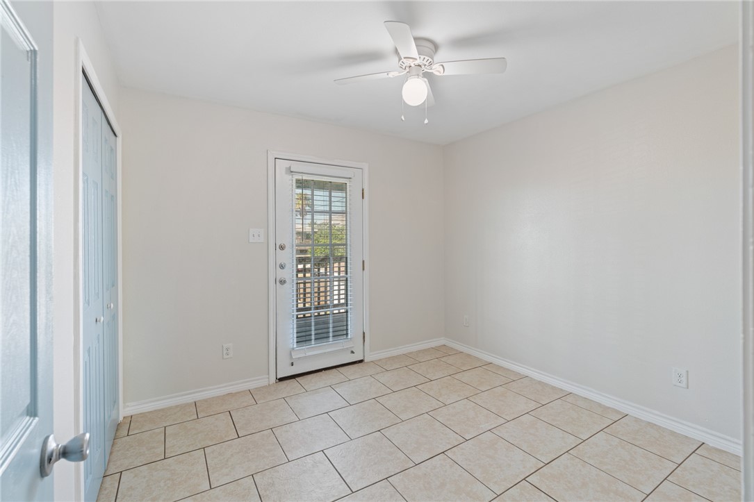 410 Knickerbocker Street Corpus Christi, TX 78418 - Photo 14 of 24 an empty room with windows and fan