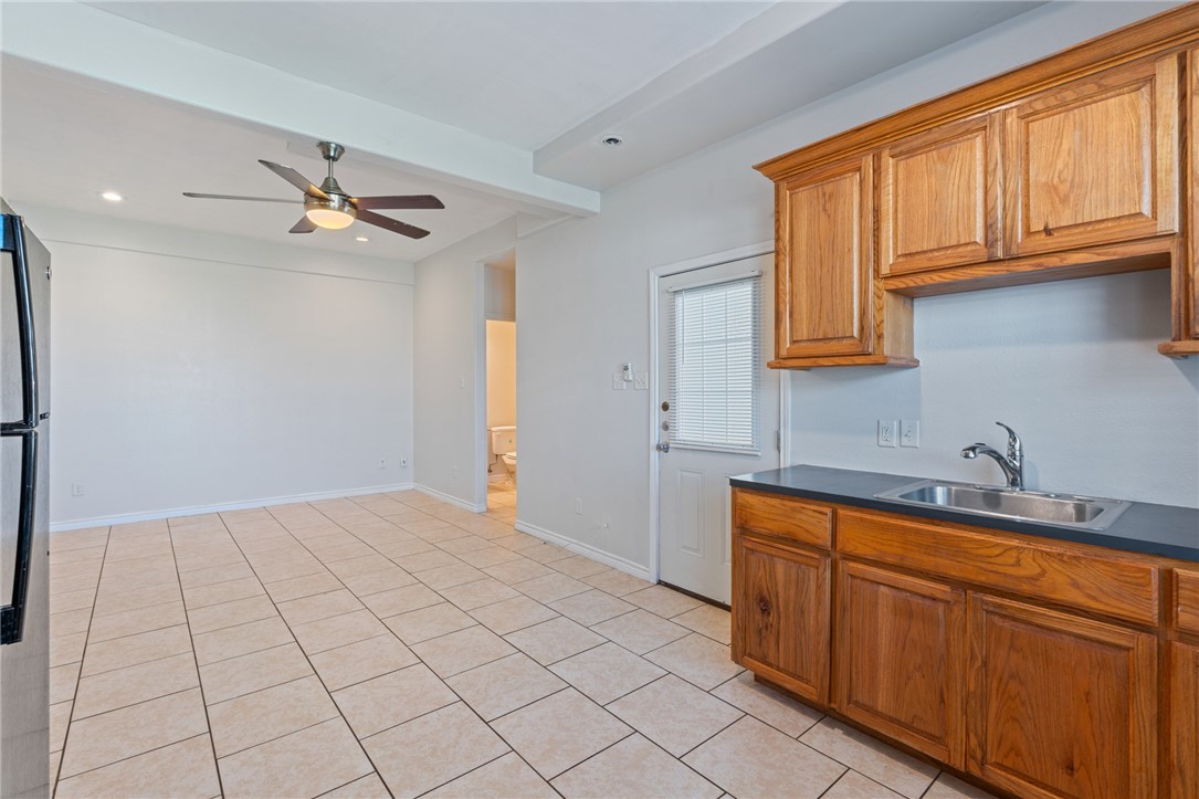 410 Knickerbocker Street Corpus Christi, TX 78418 - Photo 21 of 24 a view of a kitchen with sink cabinet and a window