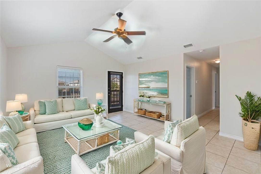 410 Knickerbocker Street Corpus Christi, TX 78418 - Photo 3 of 24 a living room with furniture and a large window