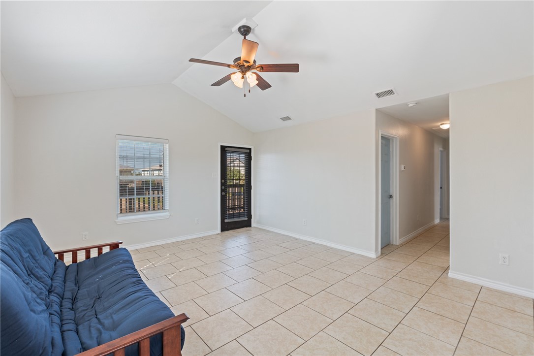 410 Knickerbocker Street Corpus Christi, TX 78418 - Photo 4 of 24 a living room with furniture and a chandelier