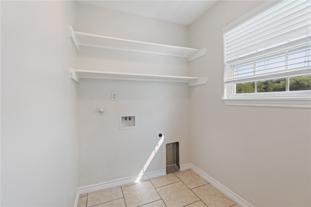 410 Knickerbocker Street Corpus Christi, TX 78418 - Photo 8 of 24 a view of an empty room with a window