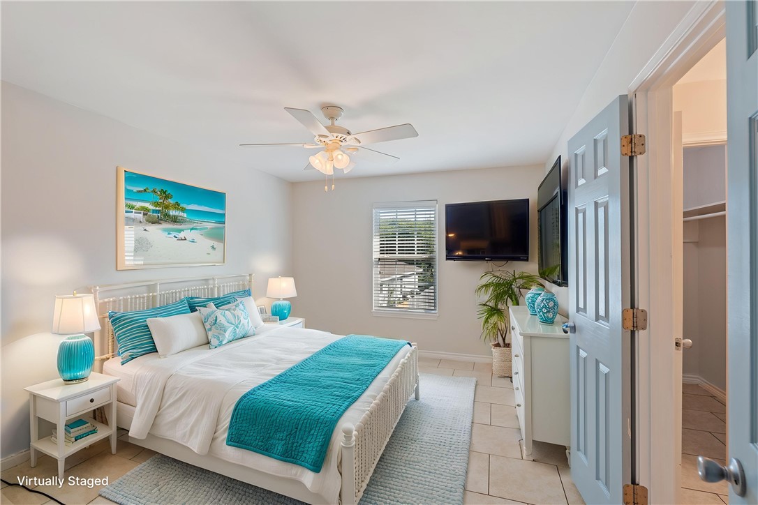 410 Knickerbocker Street Corpus Christi, TX 78418 - Photo 9 of 24 a bedroom with a bed mirror tv and a window