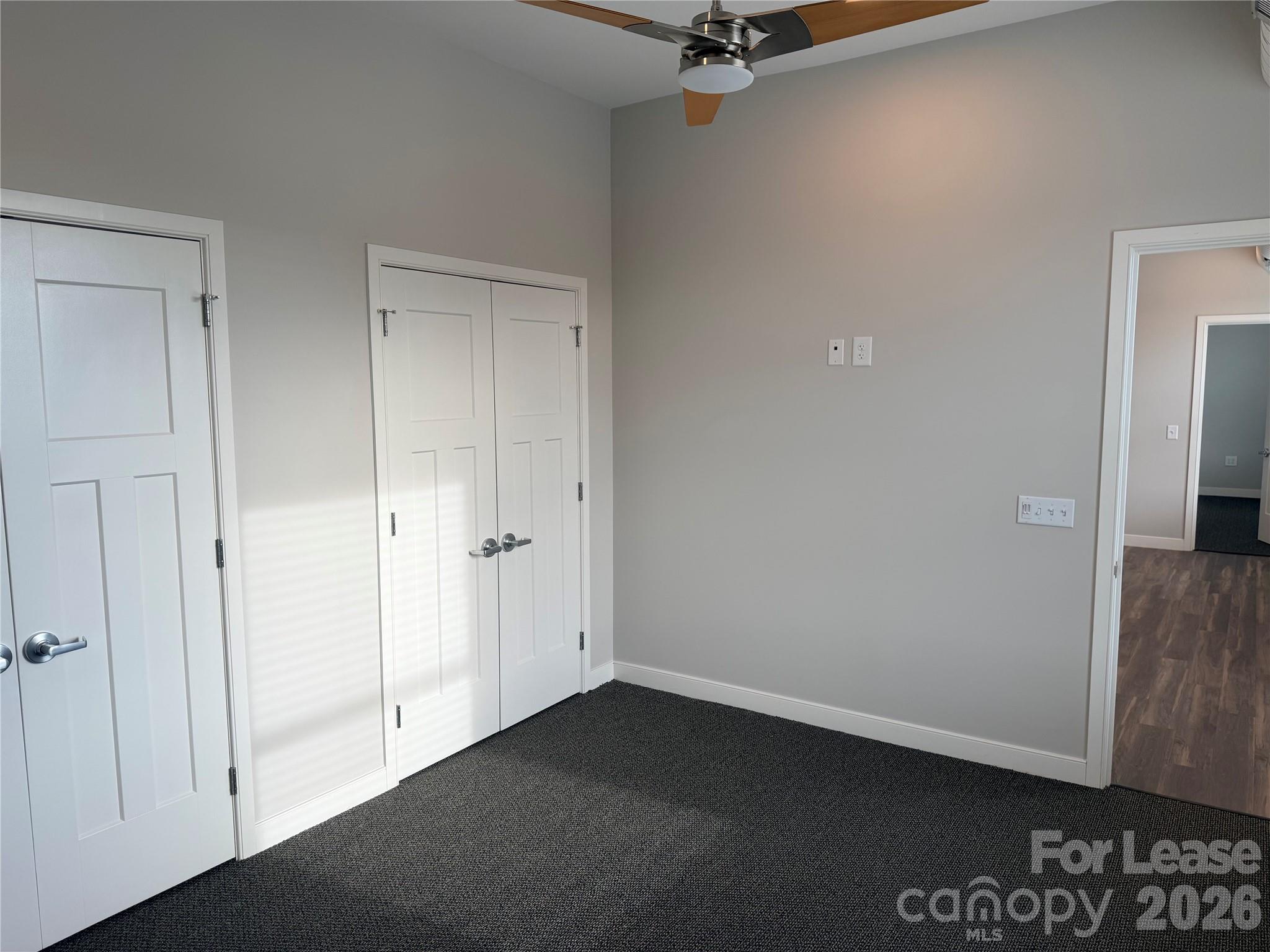 201 East Innes Street, Unit 204 Salisbury, NC 28144 - Photo 18 of 24 a view of a closet area with wooden floor