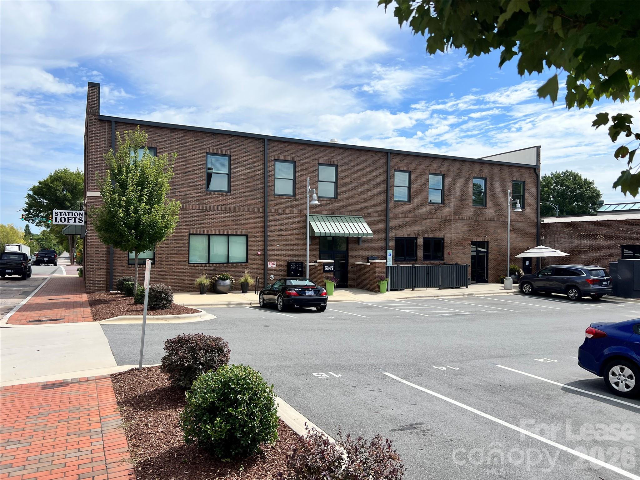 201 East Innes Street, Unit 204 Salisbury, NC 28144 - Photo 24 of 24 a view of a car parked in front of a brick house