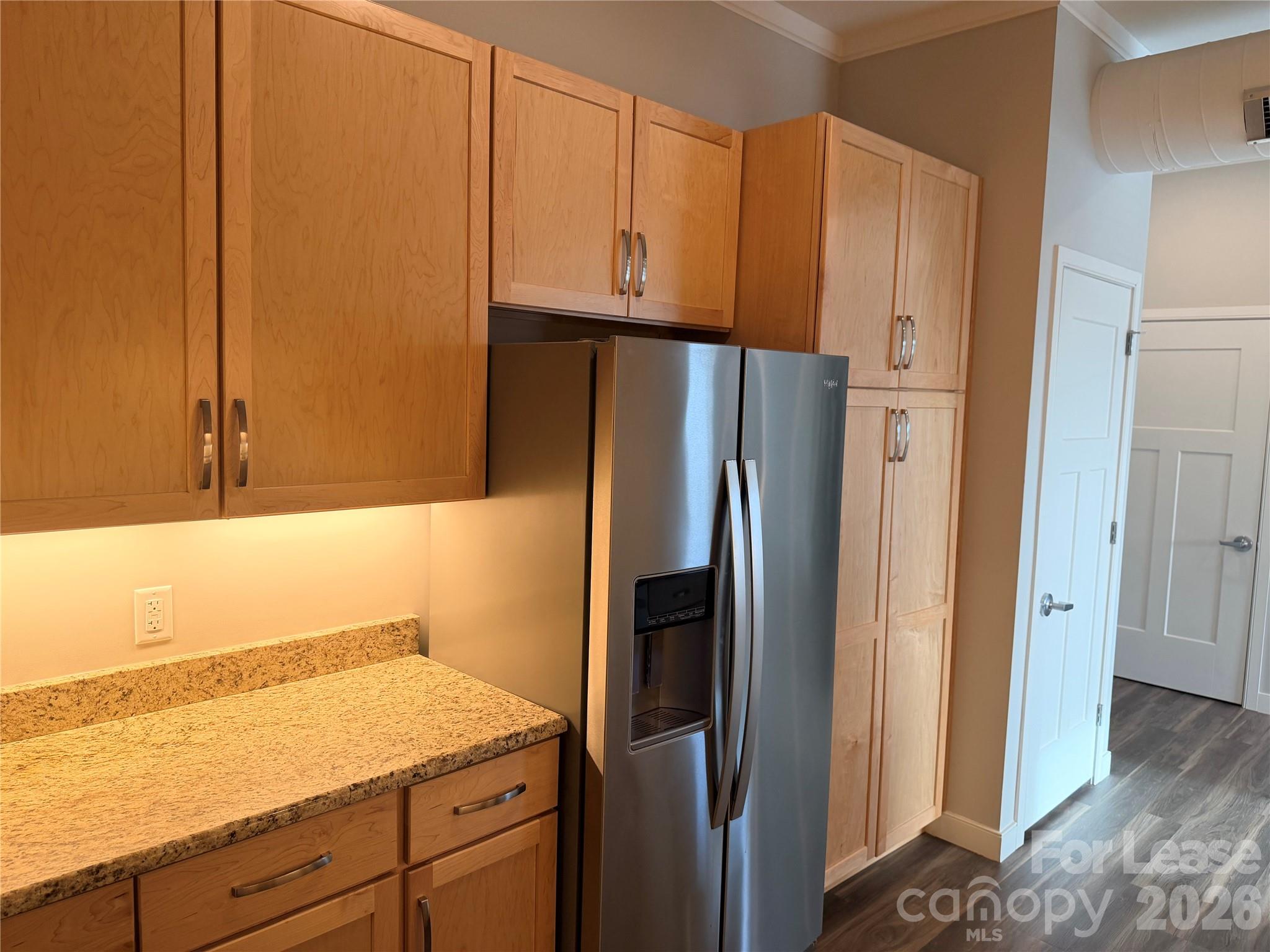 201 East Innes Street, Unit 204 Salisbury, NC 28144 - Photo 5 of 24 a kitchen with appliances and cabinets