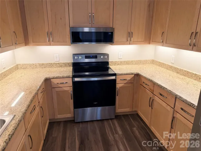 a kitchen with a stove and a sink