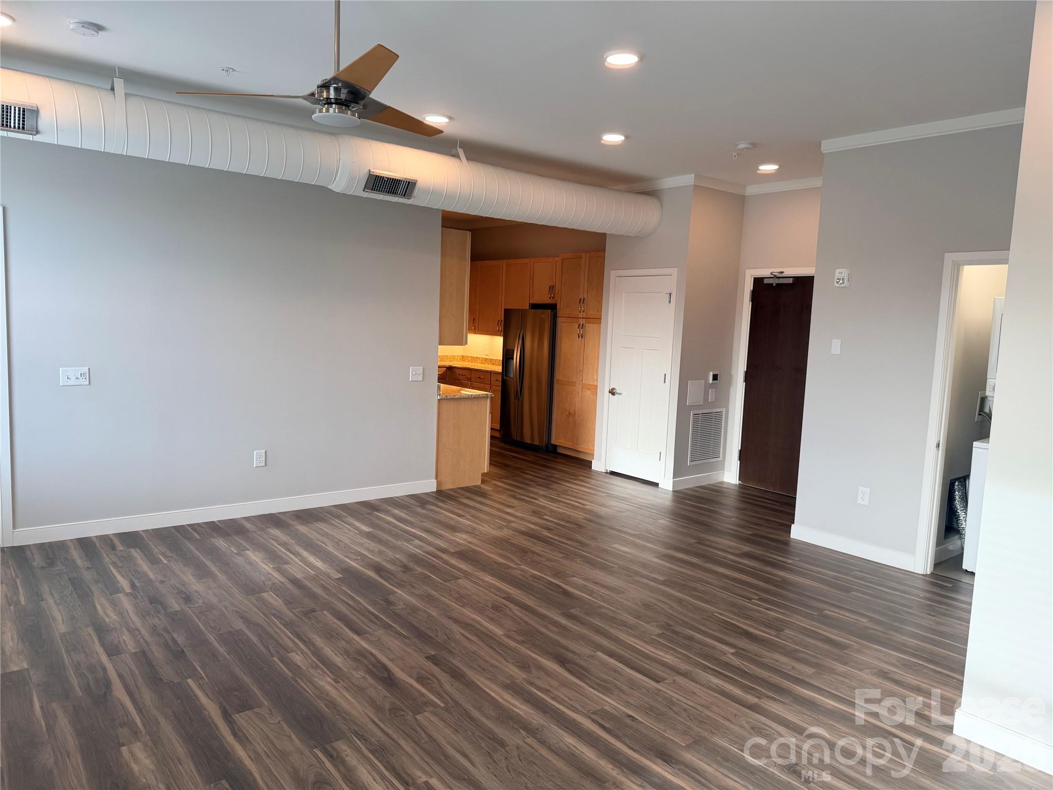 201 East Innes Street, Unit 204 Salisbury, NC 28144 - Photo 7 of 24 a view of a livingroom with wooden floor
