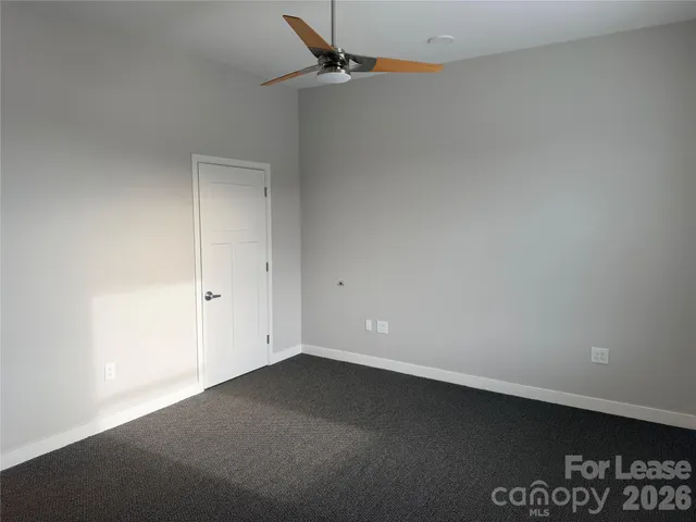 an empty room with a potted plant