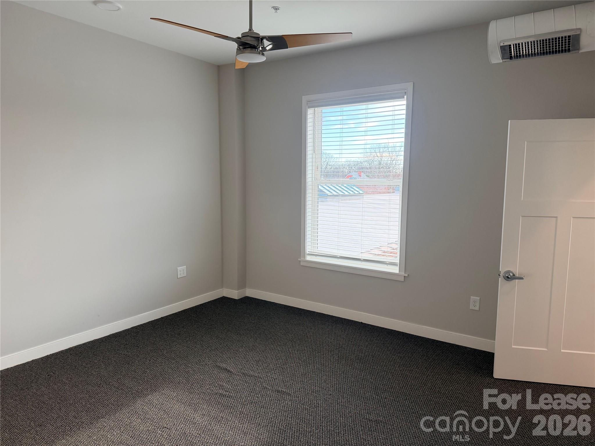201 East Innes Street, Unit 204 Salisbury, NC 28144 - Photo 9 of 24 an empty room with a window