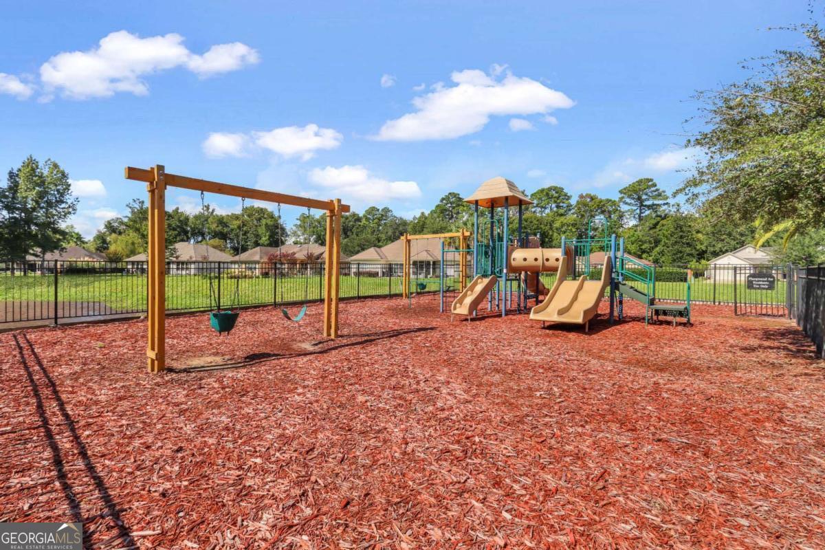 19 Clover Mill Point Brunswick, GA 31525 - Photo 5 of 9 a view of a park with swings and slides