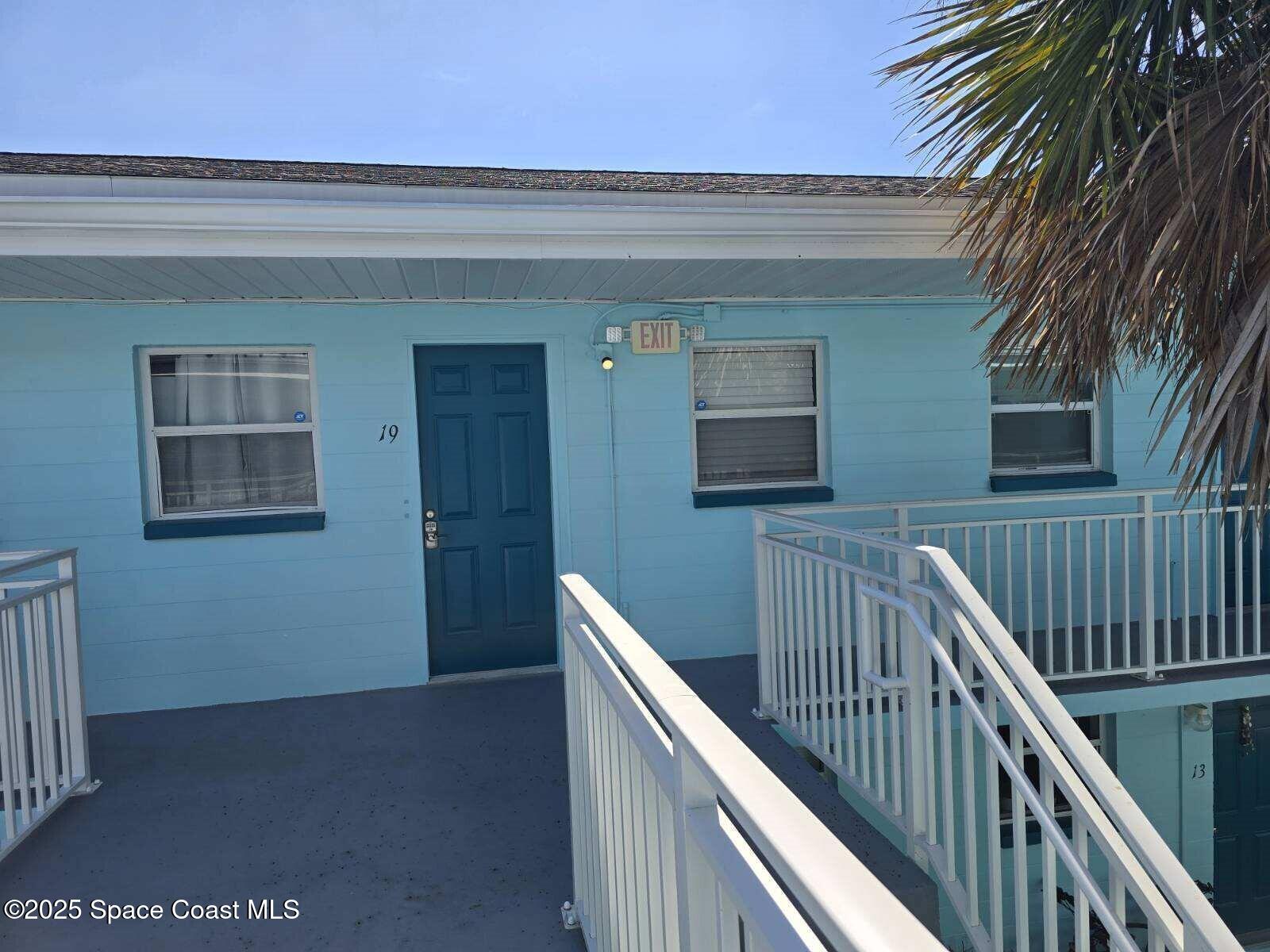 406 Tyler Avenue, Unit 19 Cape Canaveral, FL 32920 - Photo 12 of 13 a view of balcony and wooden floor