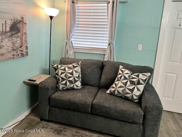 406 Tyler Avenue, Unit 19 Cape Canaveral, FL 32920 - Photo 4 of 13 a living room with furniture and a window