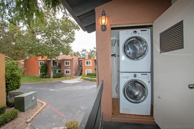 a view of a patio with a table and chairs