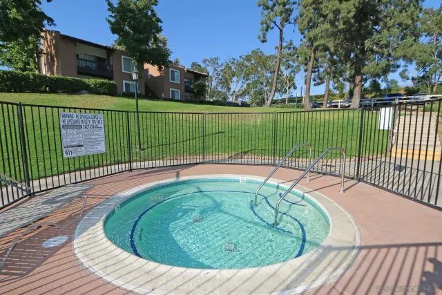 a room with gym equipment and large window