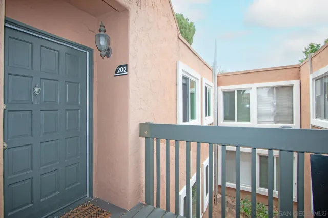 a kitchen with a sink cabinets and wooden floor