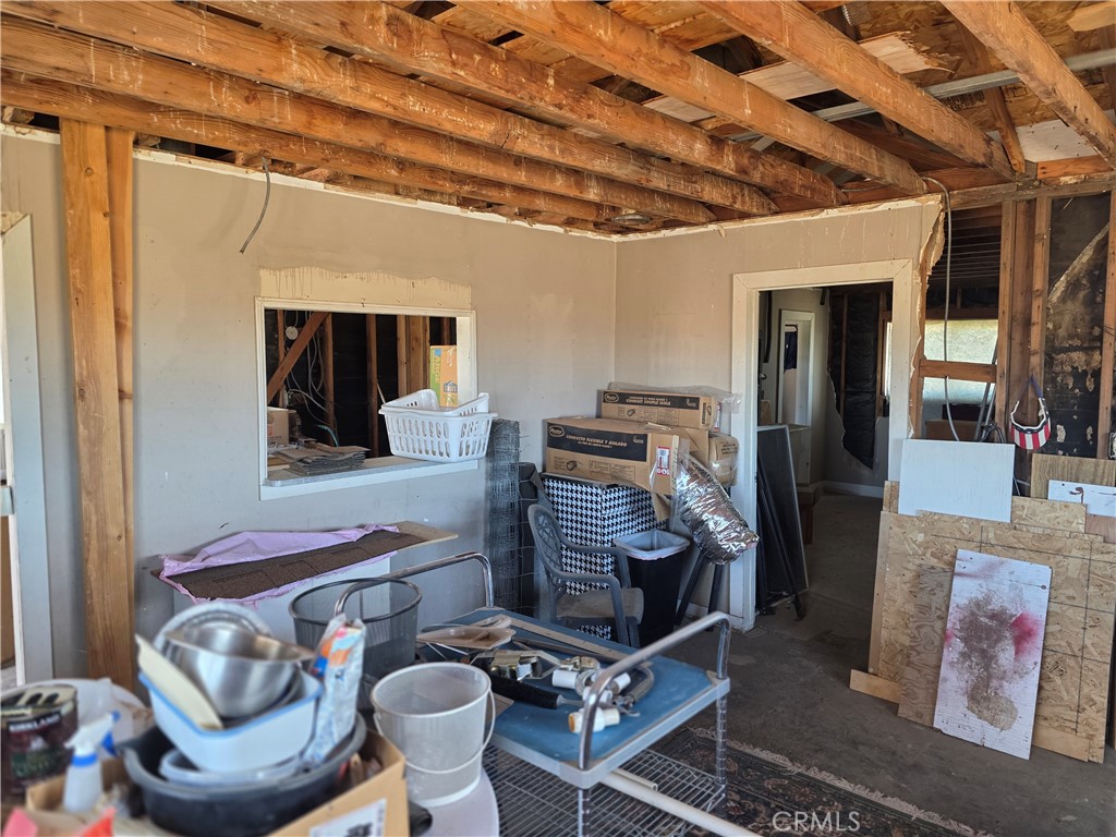 51033 Joshua Tree Road Johnson Valley, CA 92285 - Photo 22 of 30 Living room to kitchen pass through