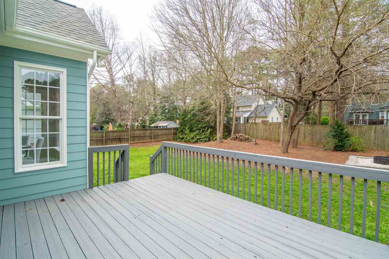 1614 Weatherford Circle Raleigh, NC 27604 - Photo 10 of 12 The deck has lots of space for enjoying the nicely landscaped yard and there's a FIRE PIT too! Nice flat yard -plenty of space for kids or pets to play! Deck