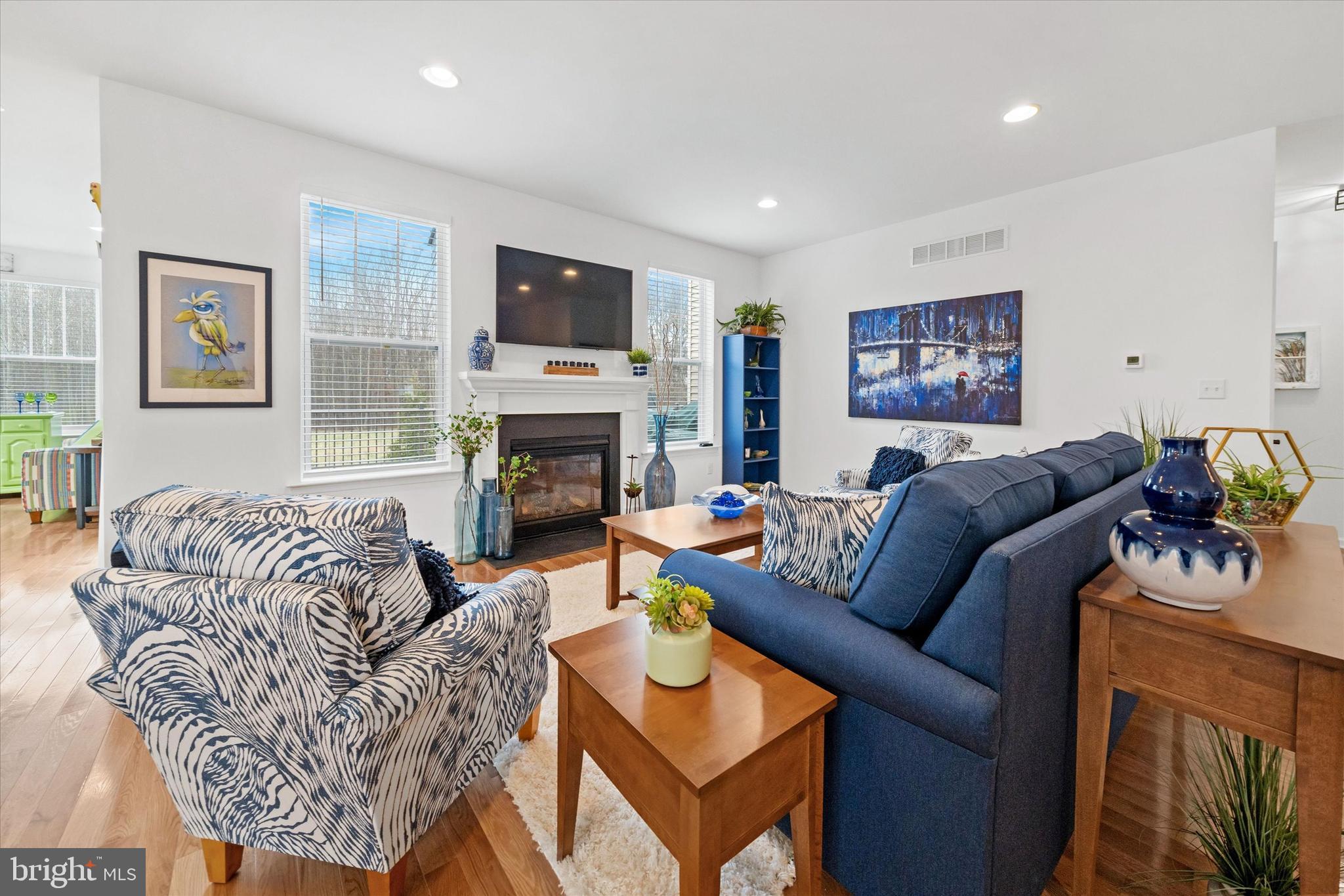 5338 Newman Lane Middletown, DE 19709 - Photo 18 of 61 a living room with furniture a flat screen tv and a fireplace