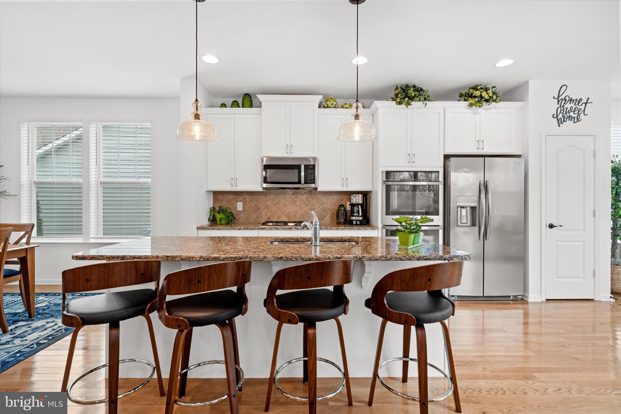 5338 Newman Lane Middletown, DE 19709 - Photo 23 of 61 a kitchen with stainless steel appliances granite countertop a stove a refrigerator and a chair