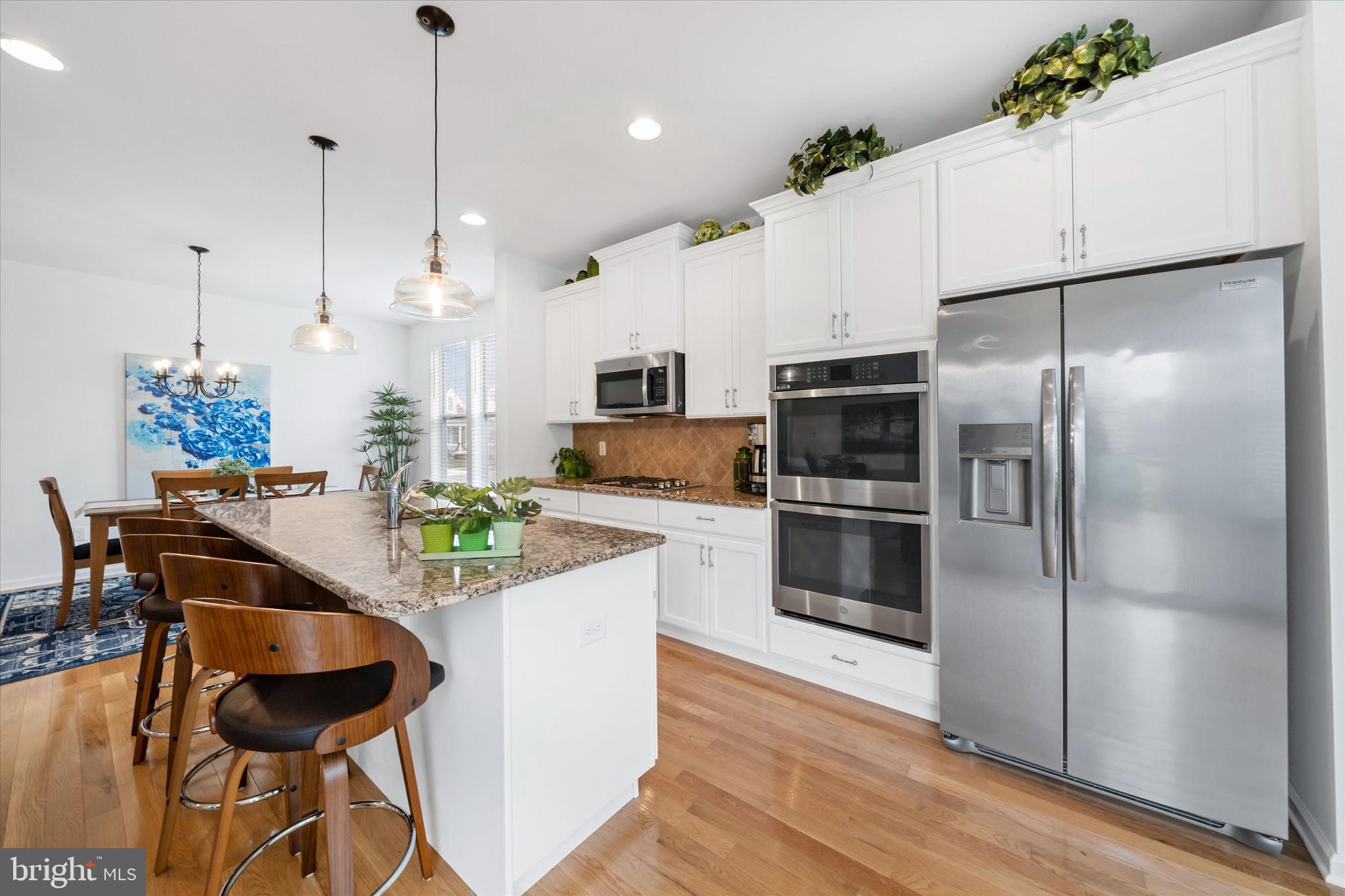 5338 Newman Lane Middletown, DE 19709 - Photo 25 of 61 a kitchen with kitchen island a counter top space appliances and cabinets